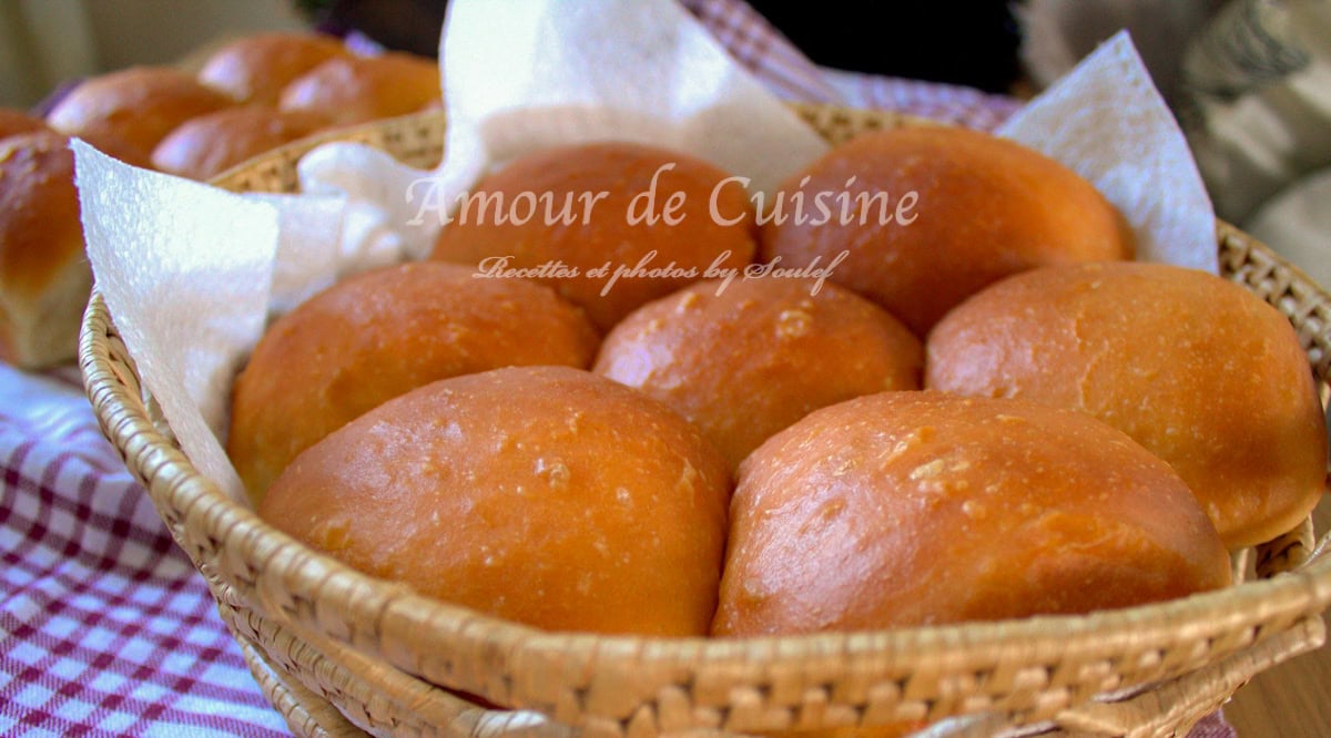 Homemade soft dinner rolls, golden from the oven and beautifully presented in a wicker basket lined with paper towels