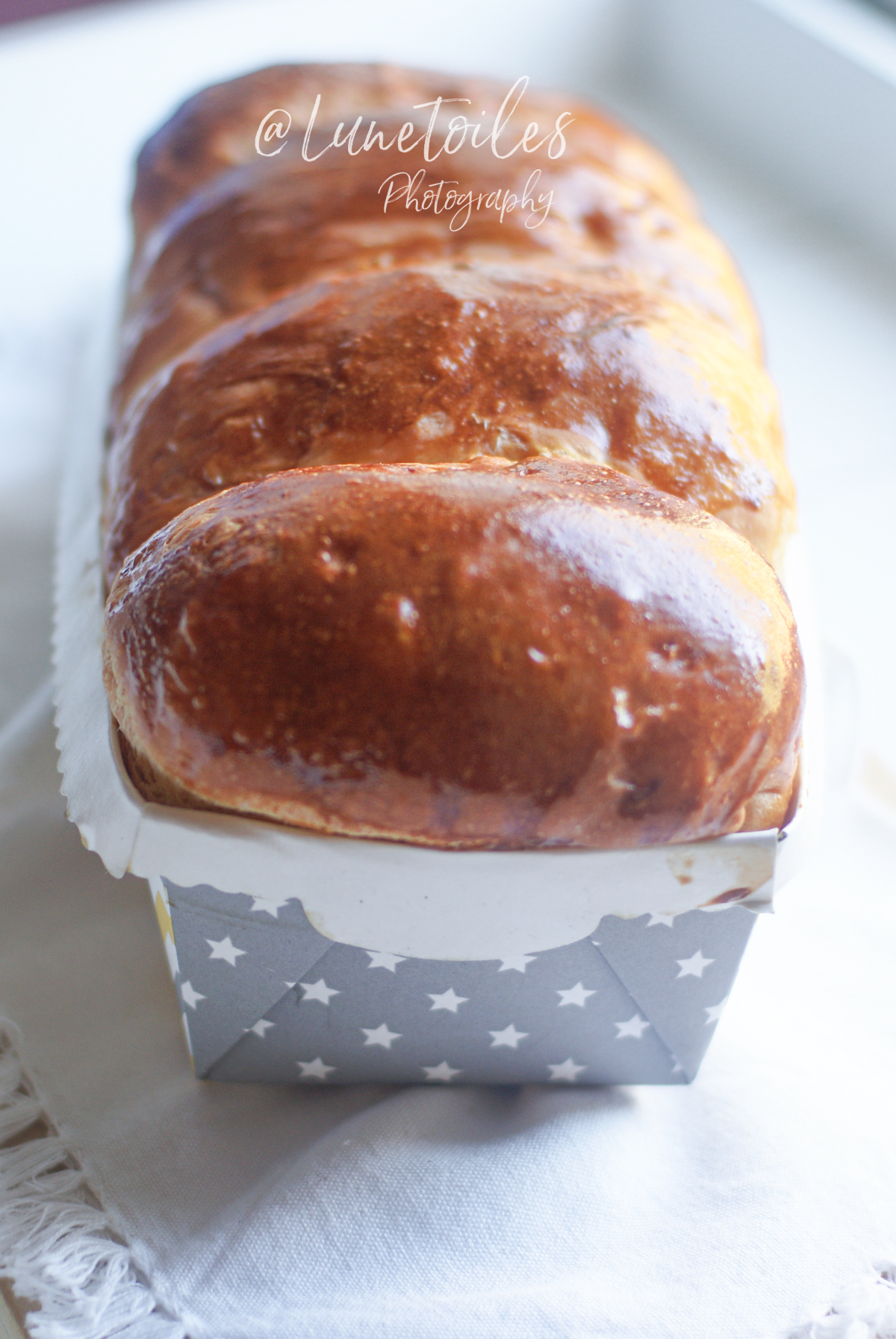 Homemade Hokkaido Japanese milk bread, shiny and risen brioche, golden from the oven and presented in a star-decorated mold