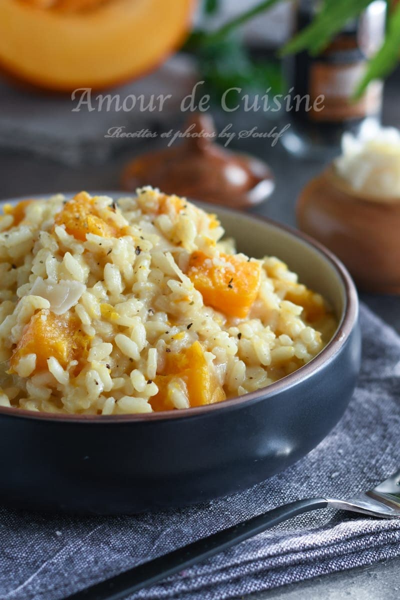Bowl of creamy pumpkin risotto, topped with tender squash pieces and soft arborio rice, a comforting and flavorful Italian autumn dish.