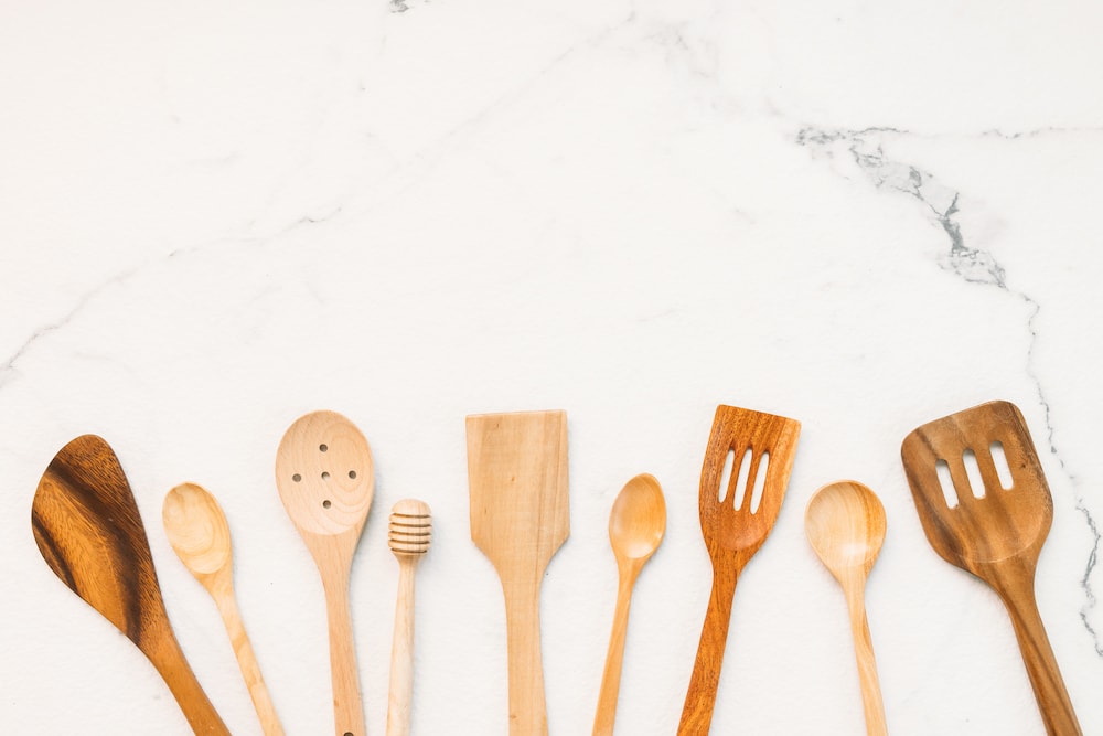 Kitchen utensils with copy space on white marble stone background